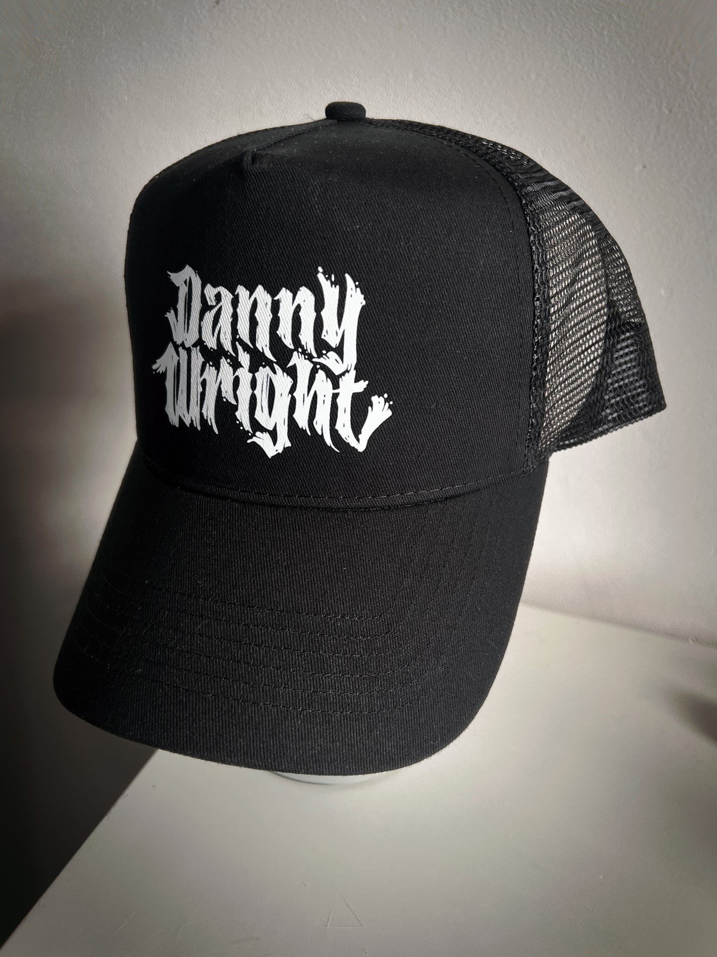 Limited Edition All-Black Trucker Hat with White Danny Wright Logo
